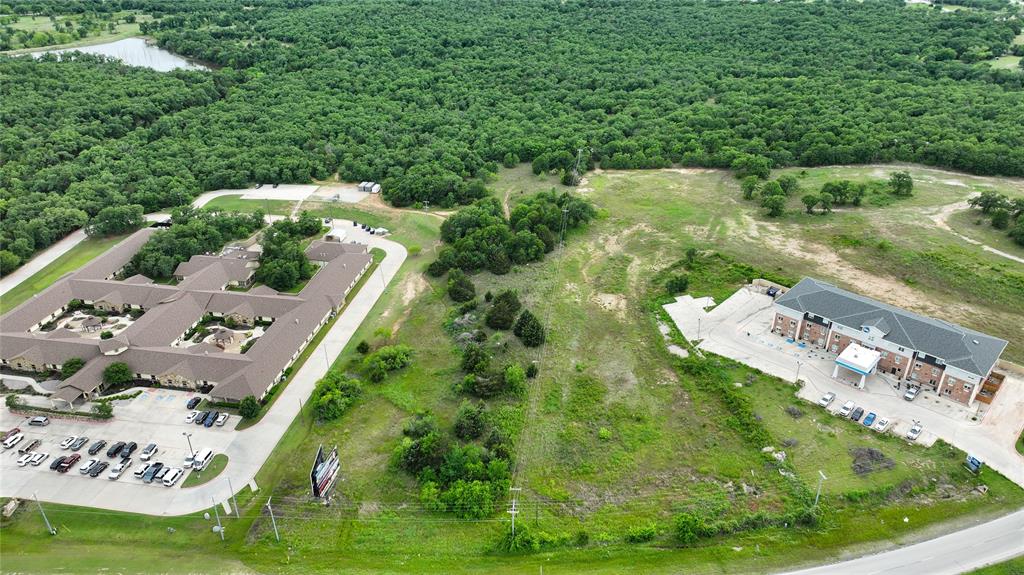 287 South Access Road Bowie, TX 76230 - Photo 9 of 20 an aerial view of residential houses with outdoor space