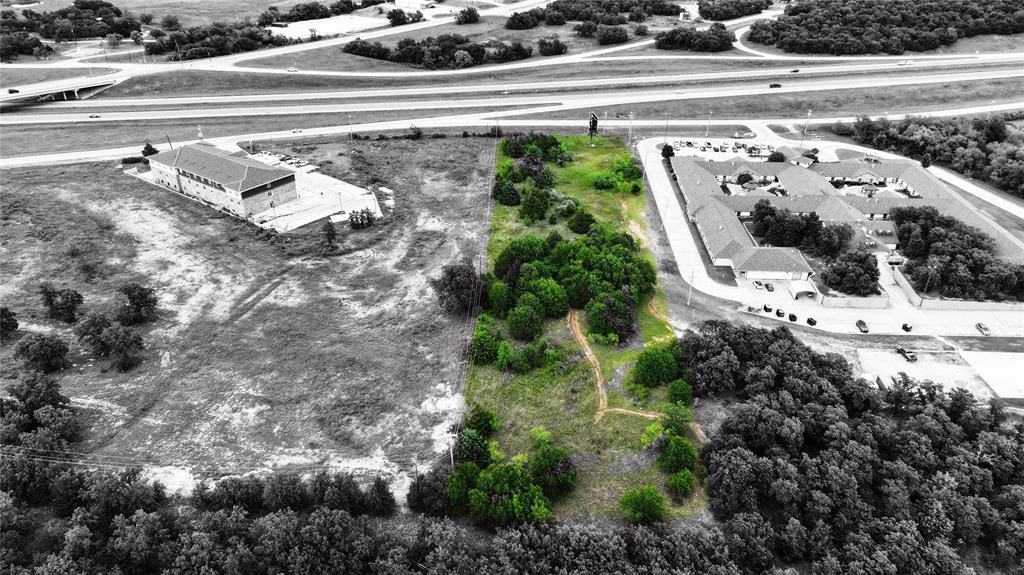 287 South Access Road Bowie, TX 76230 - Photo 10 of 20 a view of a house with a yard and large trees