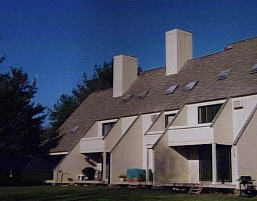 35 Hazen Road, Unit 4F Shirley, MA 01464 - Photo 1 of 1 a front view of a house with street