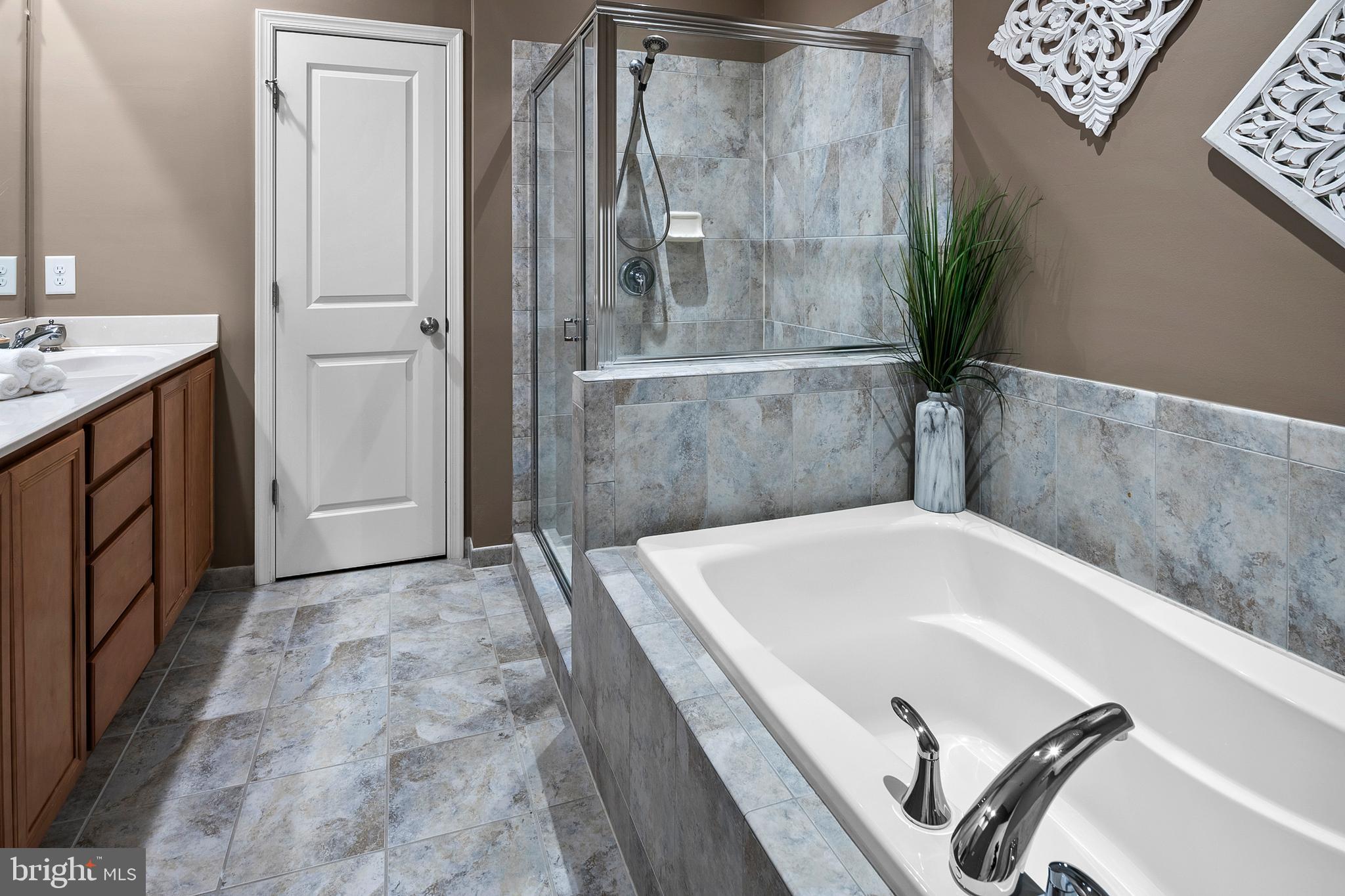 9847 Garden Ranges Laurel, MD 20723 - Photo 18 of 46 Primary Bathroom Soaking Tub and Separate Shower