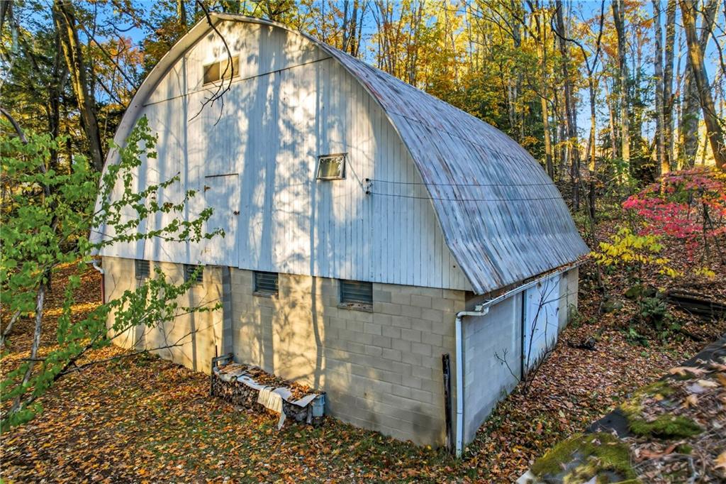 729 East Lake Road Transfer, PA 16154 - Photo 12 of 50 a yellow house with trees in front of it