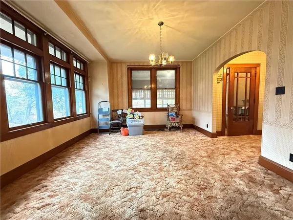 a kitchen with stainless steel appliances granite countertop a sink a stove and a microwave oven