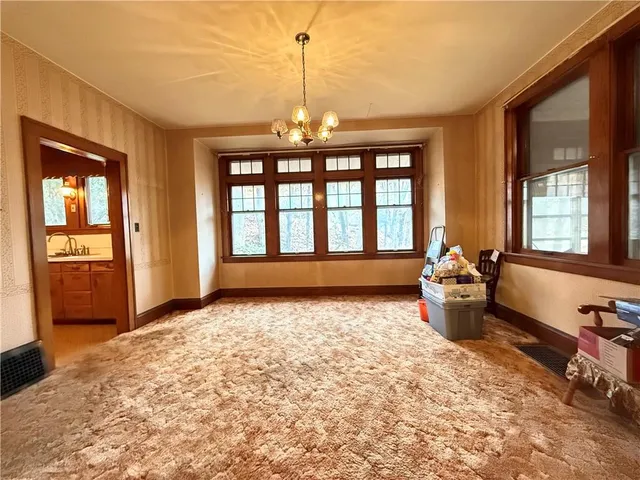 a kitchen with wooden cabinets and a stove top oven