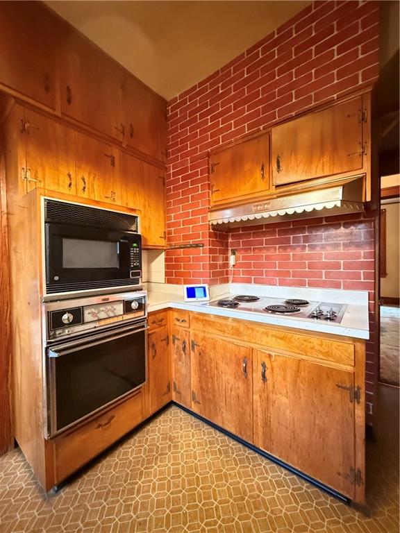 729 East Lake Road Transfer, PA 16154 - Photo 35 of 50 a kitchen with stainless steel appliances a stove a sink and a microwave