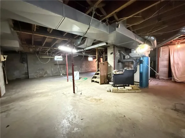 a room with gym equipment and a mirror