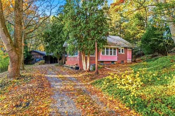 a house with trees in front of it