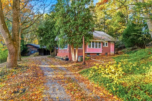 a house with trees in front of it