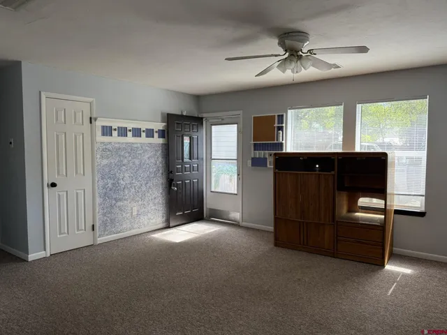 a view of an empty room with a window