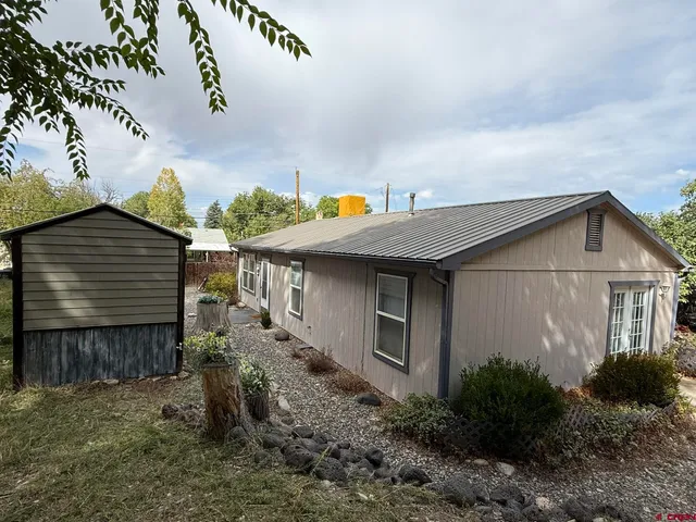 a house view with a backyard space