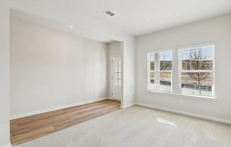 7231 Lyric Street Fairburn, GA 30213 - Photo 3 of 12 an empty room with a window
