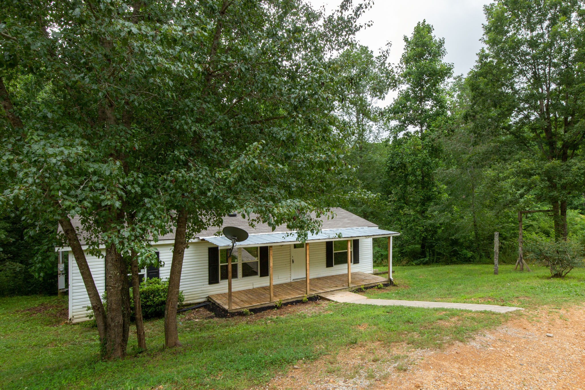 6571 Wesley Ridge Road Lyles, TN 37098 - Photo 1 of 23 a front view of house with yard and green space