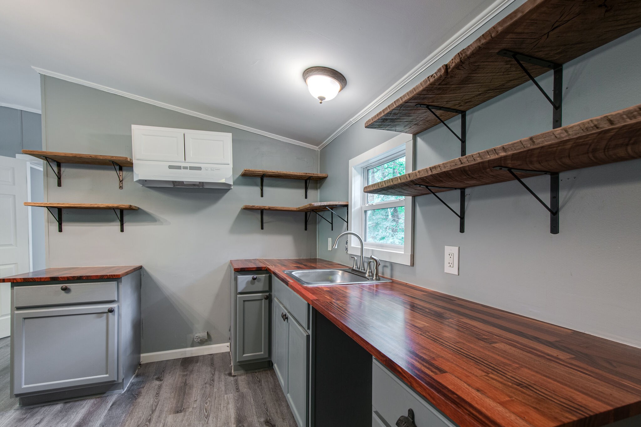 6571 Wesley Ridge Road Lyles, TN 37098 - Photo 11 of 23 a kitchen with stainless steel appliances granite countertop a sink dishwasher stove and cabinets