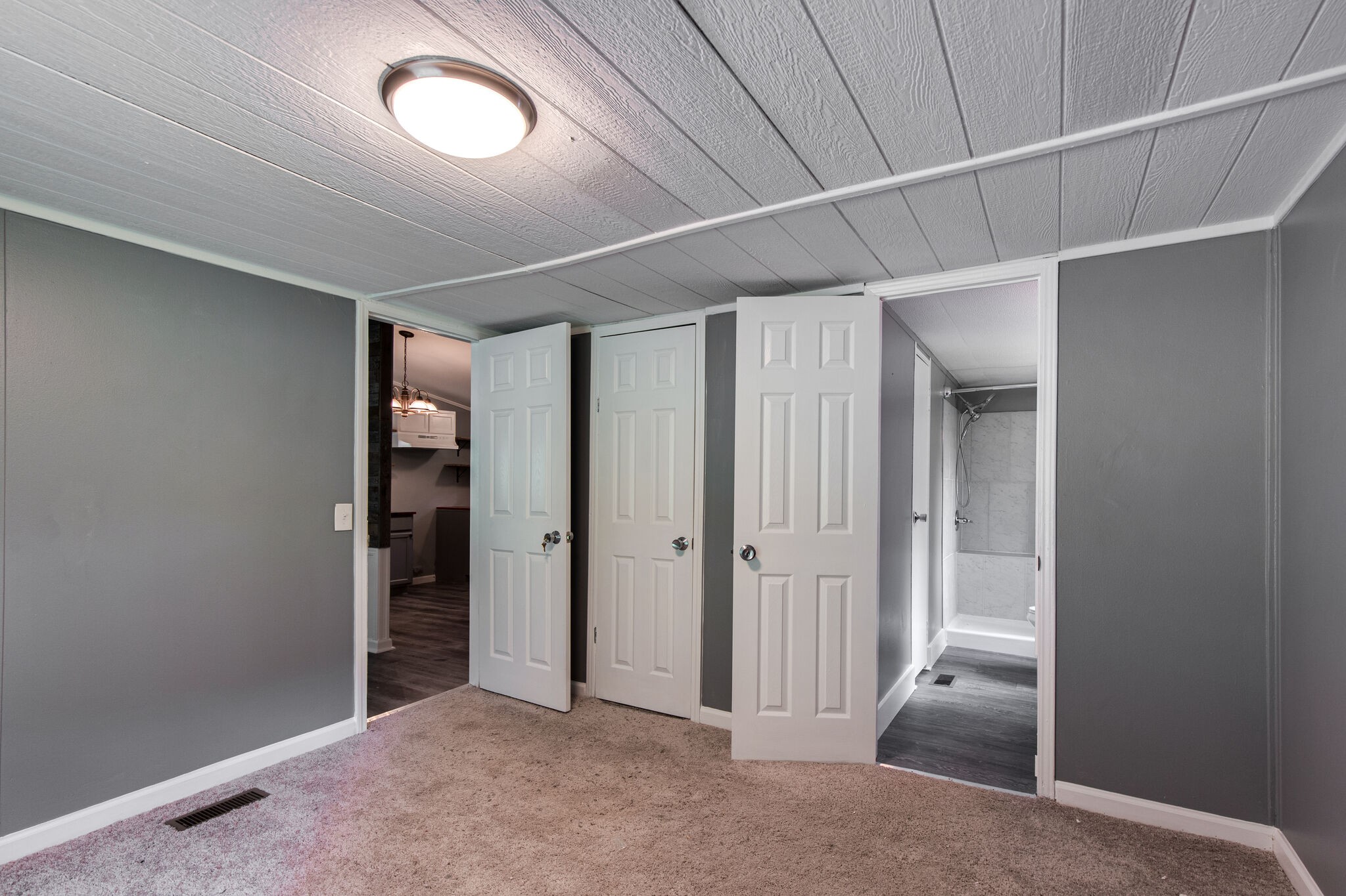 6571 Wesley Ridge Road Lyles, TN 37098 - Photo 17 of 23 an empty room with closet and mirrors