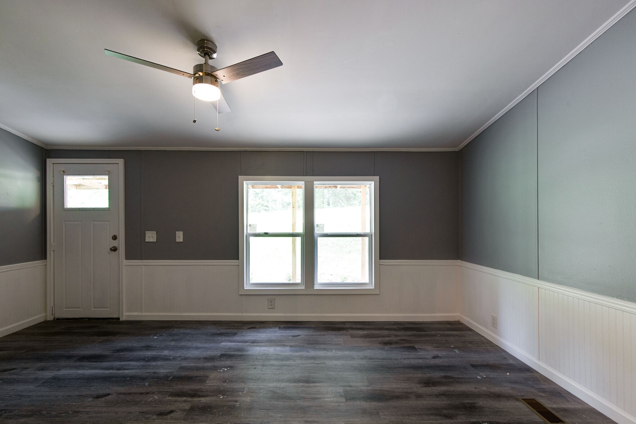 6571 Wesley Ridge Road Lyles, TN 37098 - Photo 4 of 23 a view of an empty room with wooden floor and a window