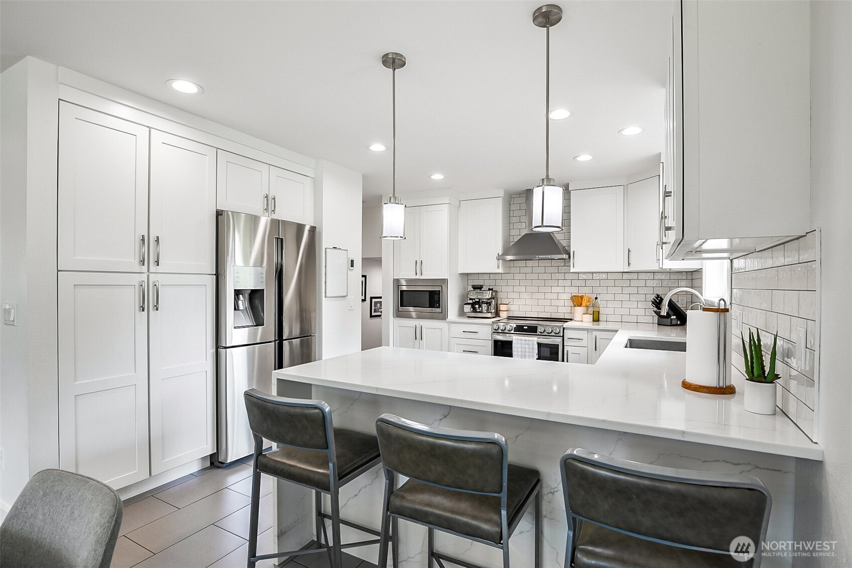 1939 Grandview Road Ferndale, WA 98248 - Photo 12 of 39 a kitchen with refrigerator a sink and cabinets