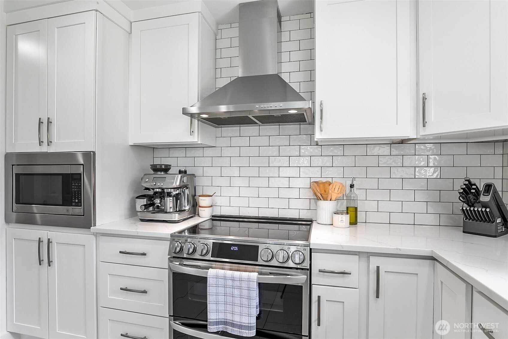 1939 Grandview Road Ferndale, WA 98248 - Photo 13 of 39 a kitchen with white cabinets and appliances