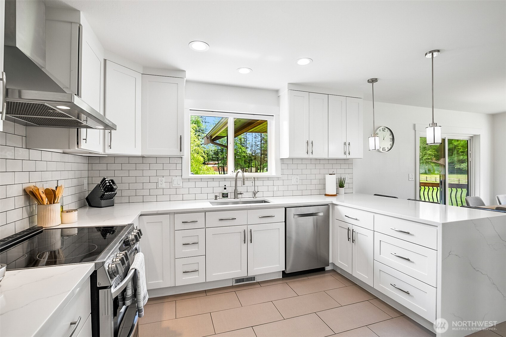 1939 Grandview Road Ferndale, WA 98248 - Photo 14 of 39 a kitchen with a sink stove and cabinets