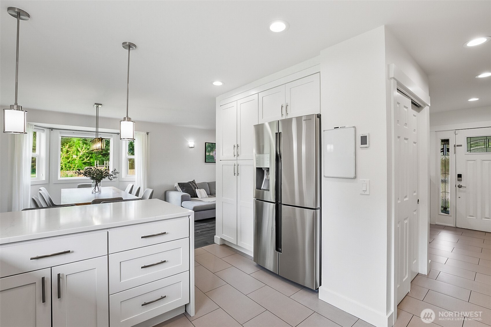 1939 Grandview Road Ferndale, WA 98248 - Photo 15 of 39 a kitchen with kitchen island a counter top space a refrigerator and a sink