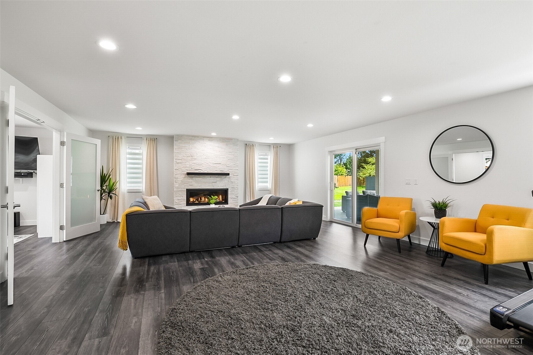 1939 Grandview Road Ferndale, WA 98248 - Photo 16 of 39 a living room with furniture a rug and a fireplace
