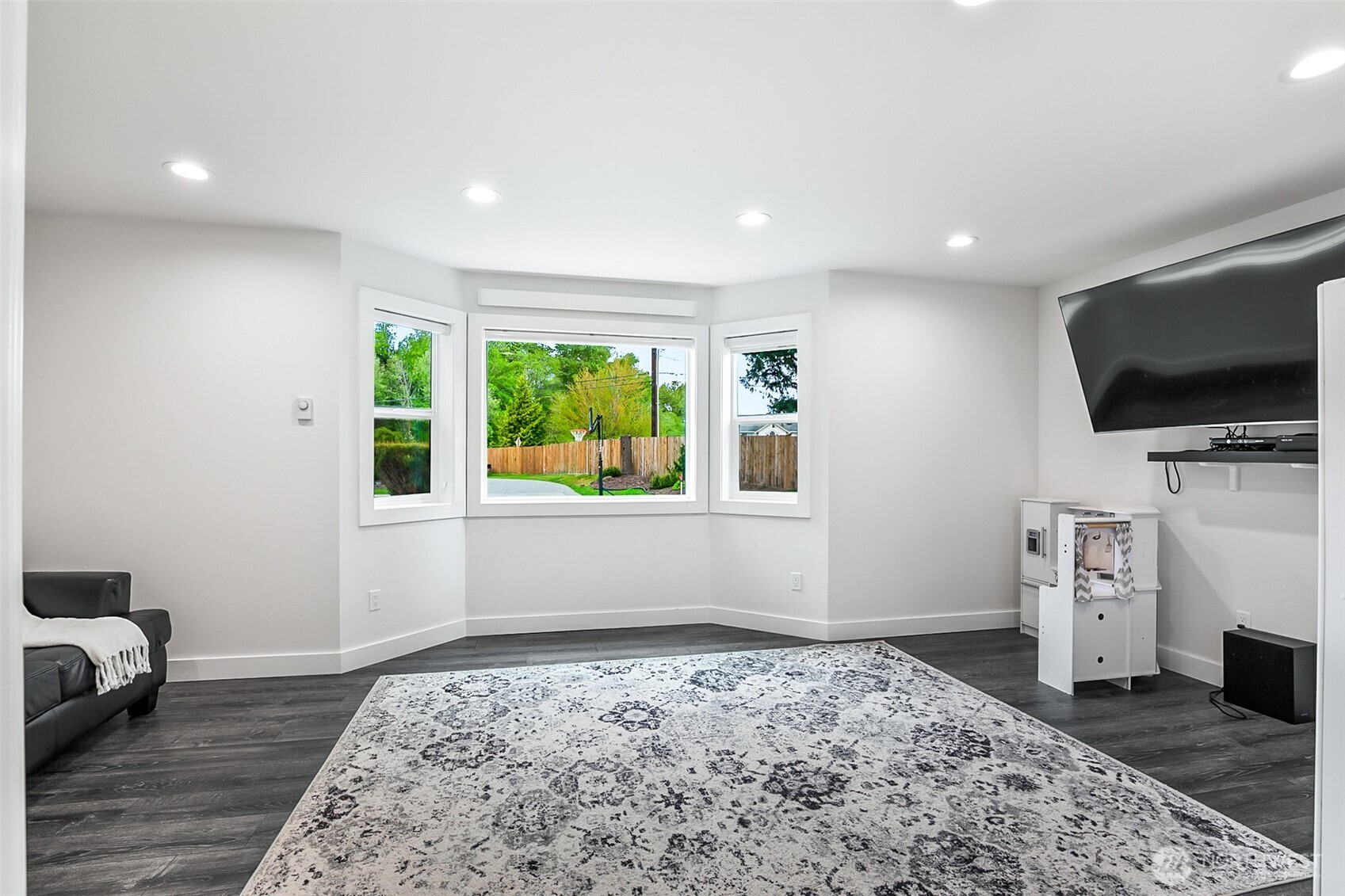 1939 Grandview Road Ferndale, WA 98248 - Photo 17 of 39 a view of a workspace with furniture and a flat screen tv