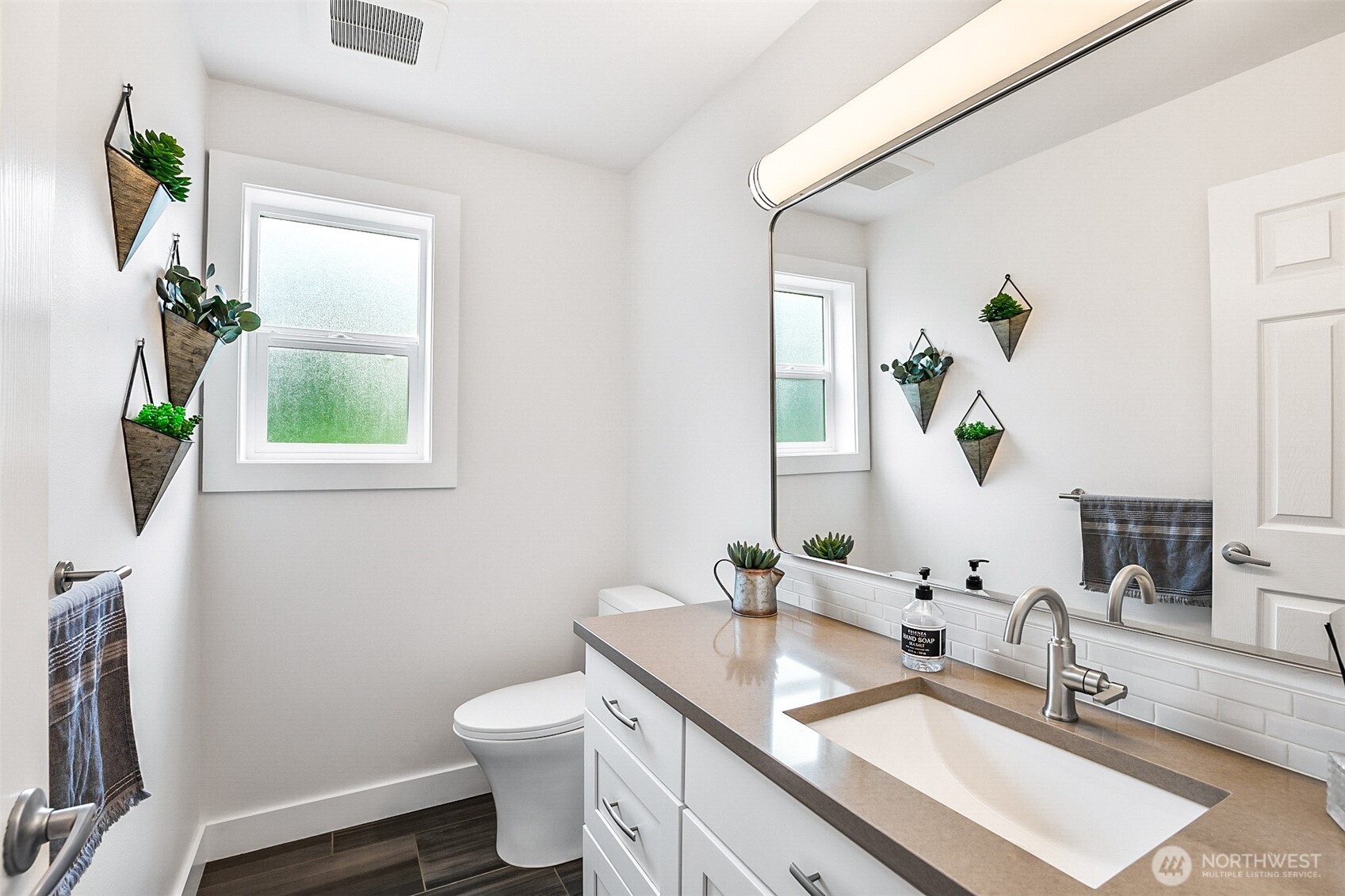 1939 Grandview Road Ferndale, WA 98248 - Photo 19 of 39 a bathroom with a granite countertop toilet sink and mirror