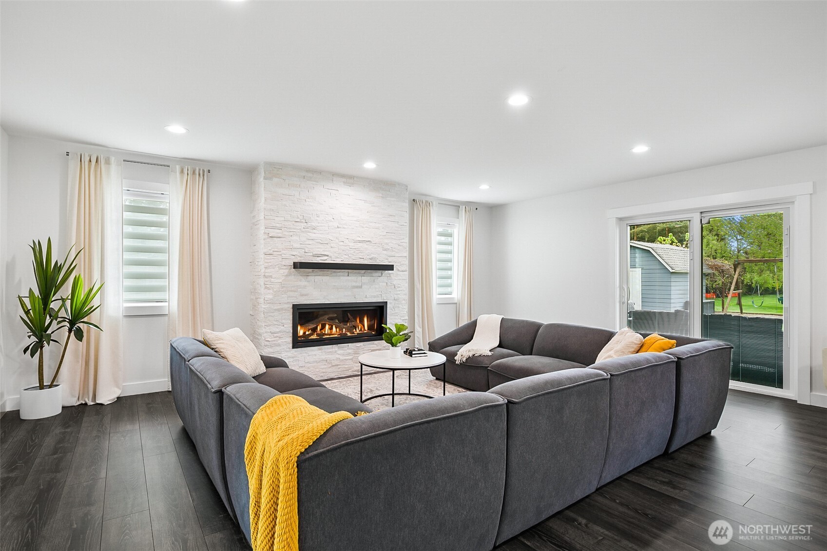 1939 Grandview Road Ferndale, WA 98248 - Photo 20 of 39 a living room with furniture and a fireplace