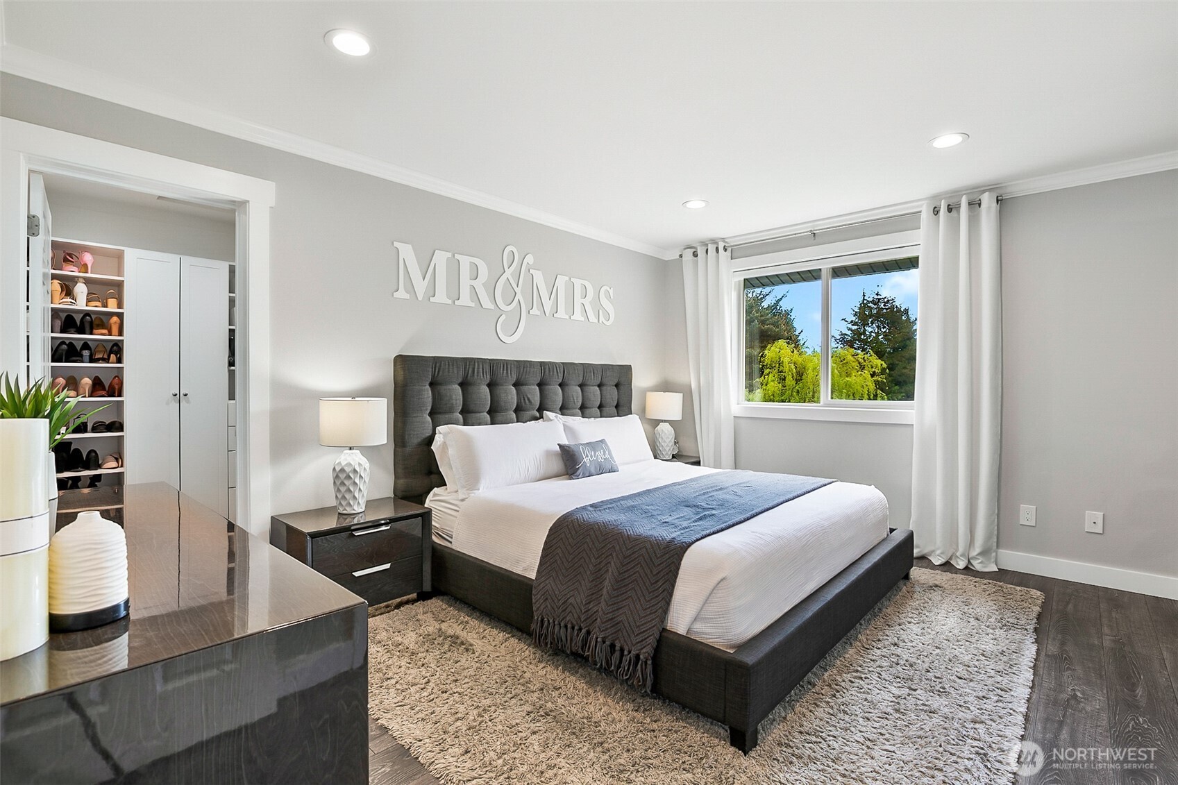 1939 Grandview Road Ferndale, WA 98248 - Photo 23 of 39 a bedroom with a bed and wooden floor