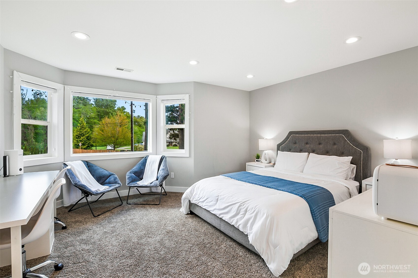 1939 Grandview Road Ferndale, WA 98248 - Photo 28 of 39 a bedroom with a bed and a lounge chair