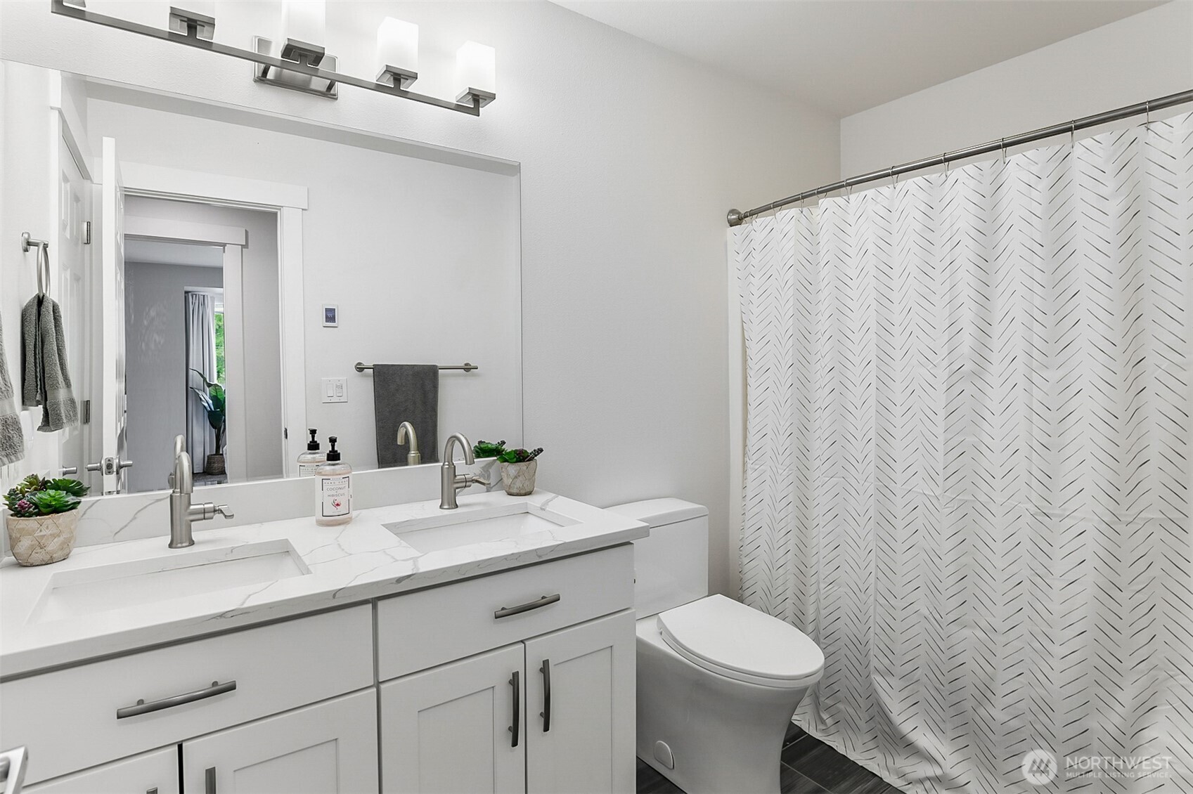 1939 Grandview Road Ferndale, WA 98248 - Photo 29 of 39 a bathroom with a sink a toilet and a mirror