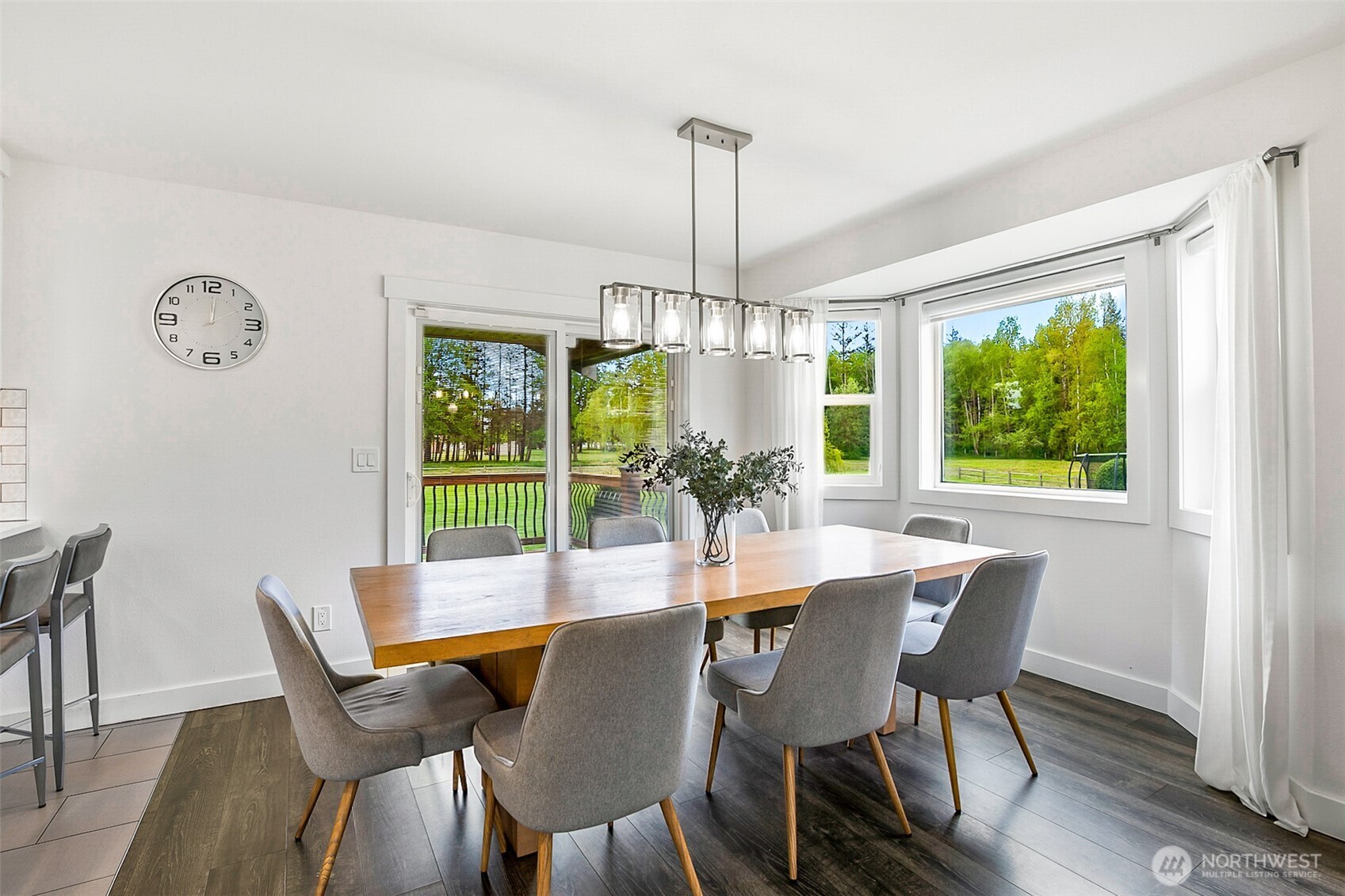 1939 Grandview Road Ferndale, WA 98248 - Photo 9 of 39 a dining room with furniture a chandelier and wooden floor