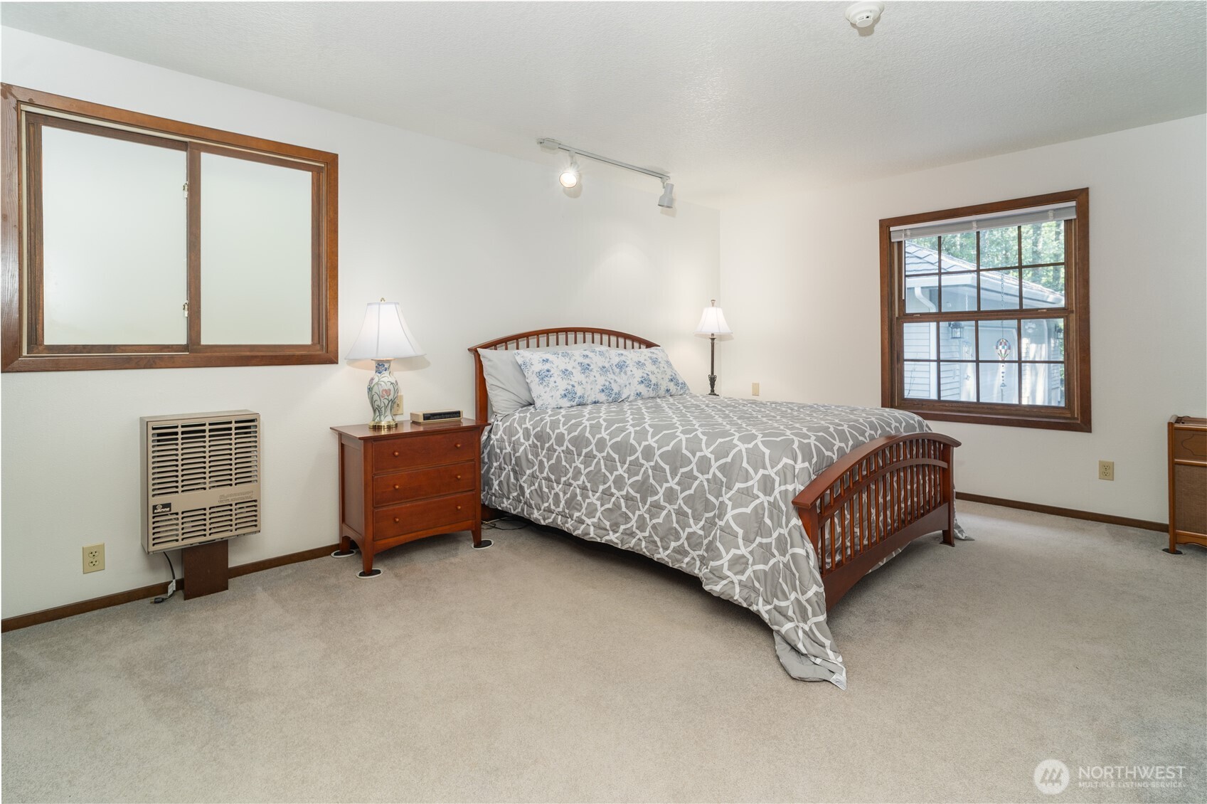 2102 Mark Street Northeast Olympia, WA 98516 - Photo 19 of 37 a bedroom with a bed dresser and a window