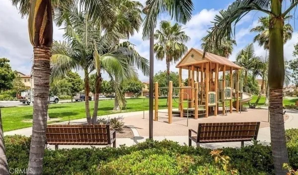 a view of a backyard with plants and a patio