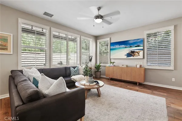 a living room with furniture and windows