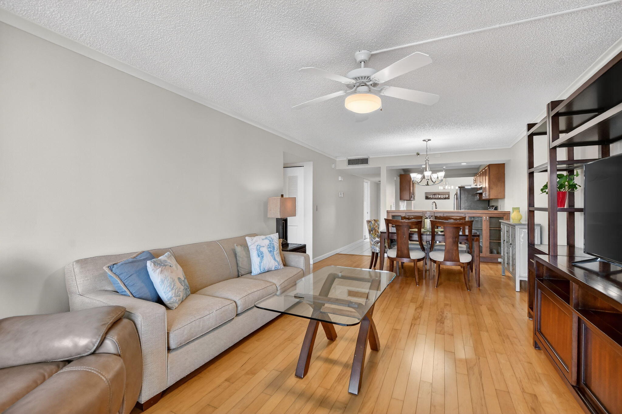 20 Royal Palm Way, Unit 602 Boca Raton, FL 33432 - Photo 11 of 56 a living room with furniture and a flat screen tv