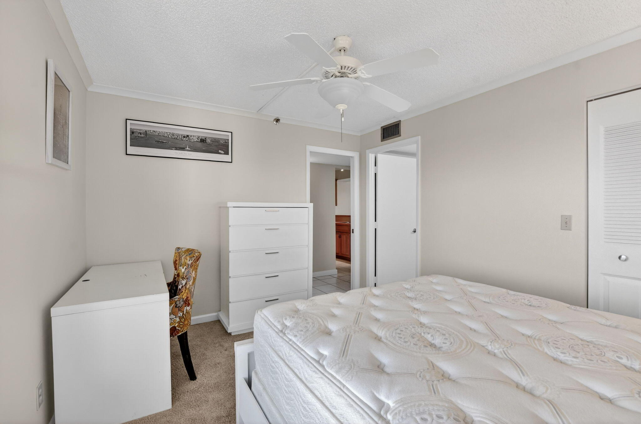 20 Royal Palm Way, Unit 602 Boca Raton, FL 33432 - Photo 20 of 56 a bedroom with a bed and a chandelier