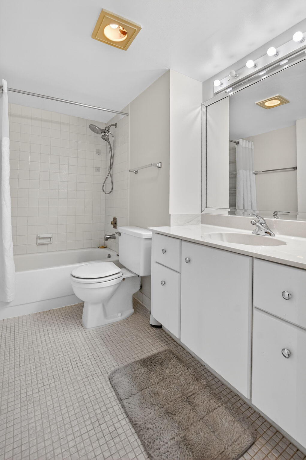 20 Royal Palm Way, Unit 602 Boca Raton, FL 33432 - Photo 21 of 56 a bathroom with a sink toilet a mirror and shower