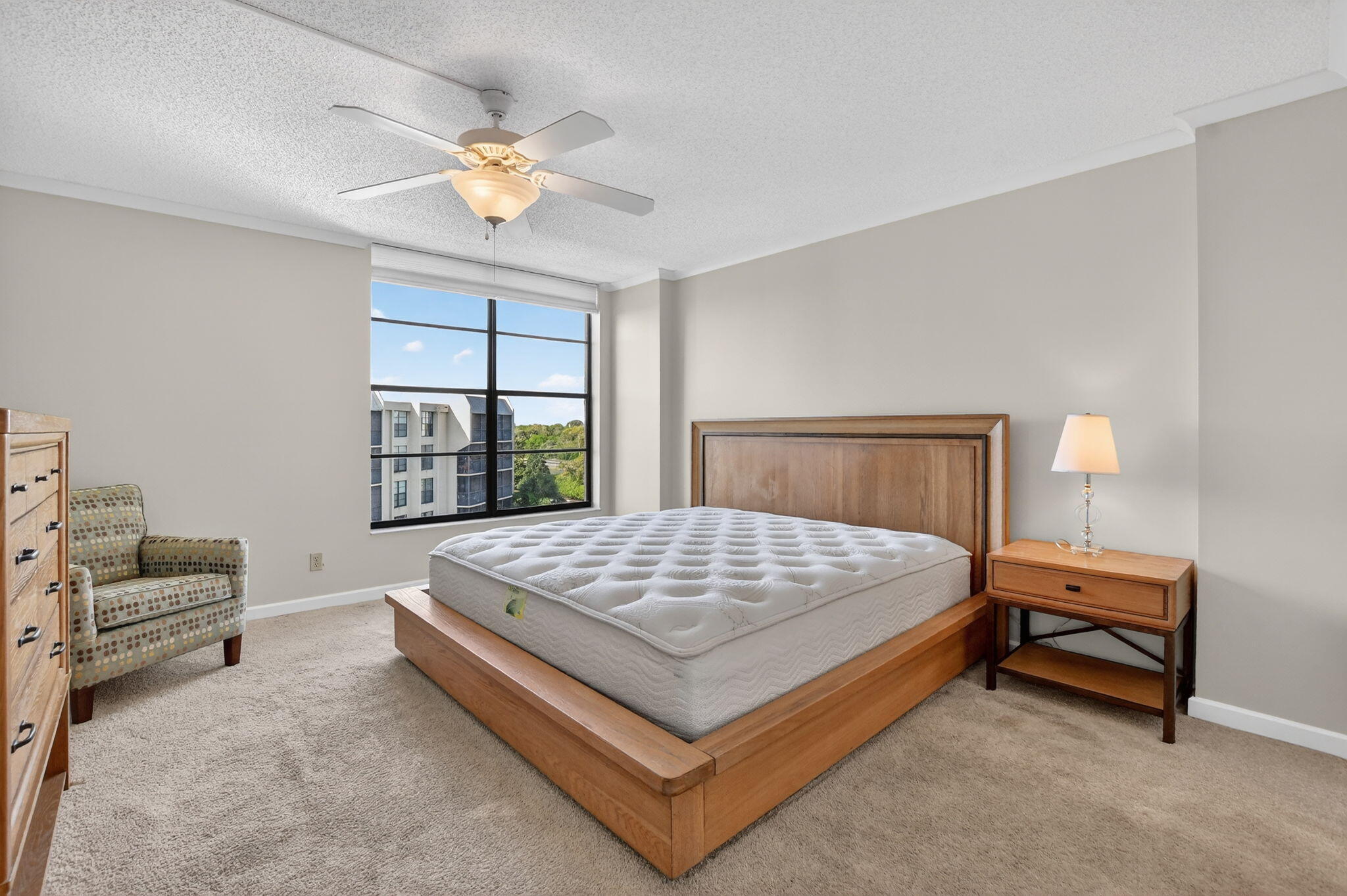 20 Royal Palm Way, Unit 602 Boca Raton, FL 33432 - Photo 23 of 56 a bedroom with a bed a couch and a window