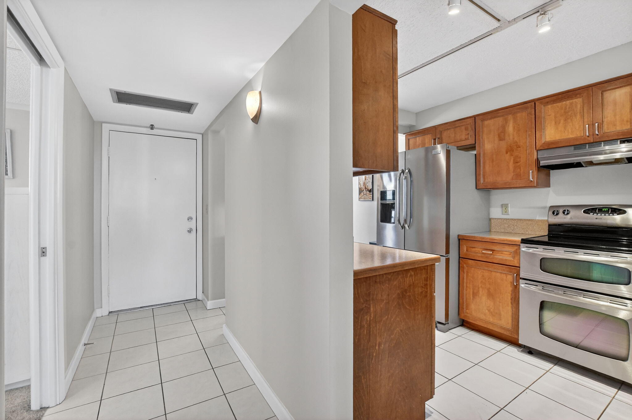 20 Royal Palm Way, Unit 602 Boca Raton, FL 33432 - Photo 4 of 56 a kitchen with stainless steel appliances granite countertop a refrigerator and a stove top oven