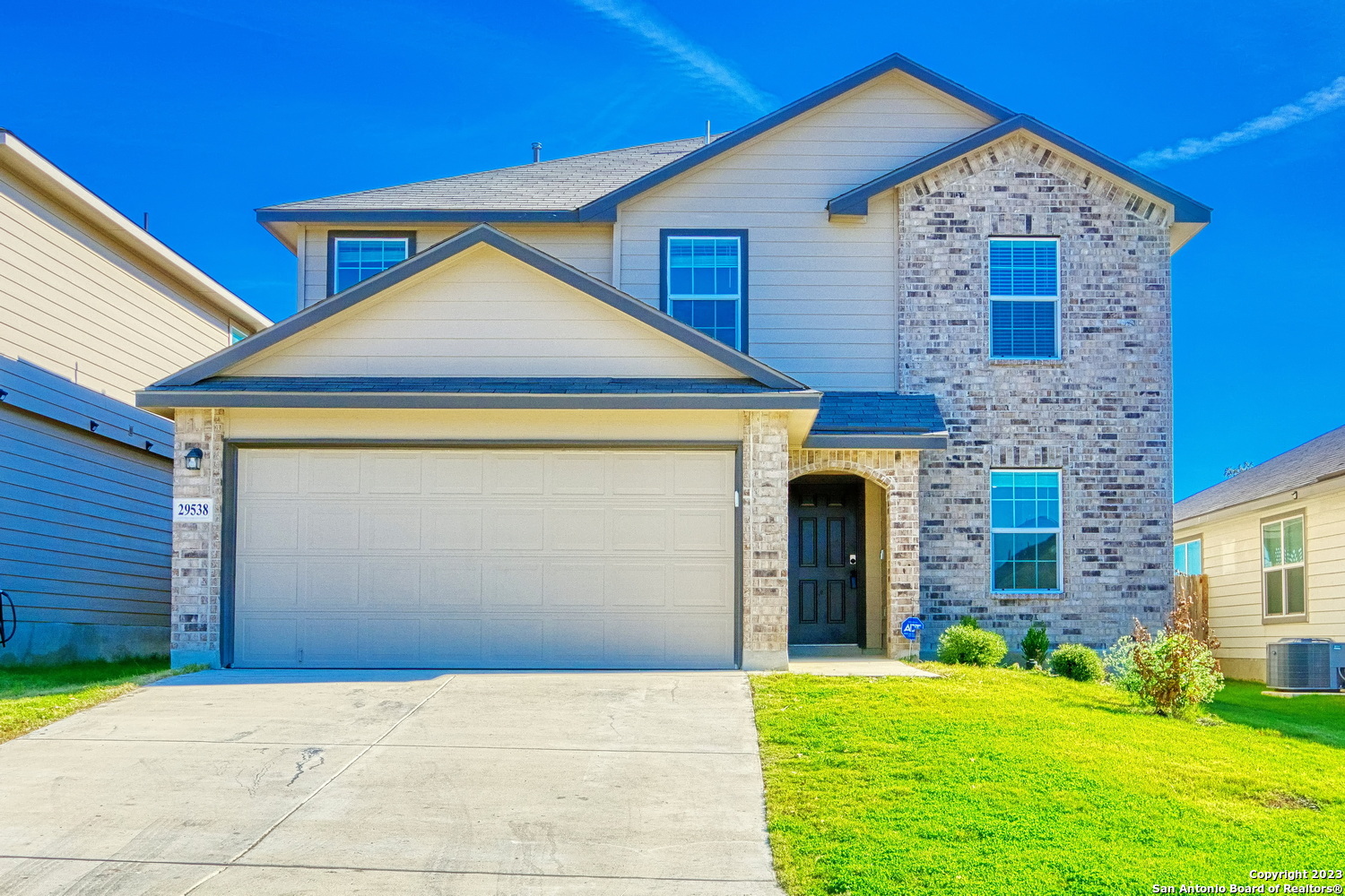 29538 Spring Copper Bulverde, TX 78163 - Photo 1 of 1 a front view of a house with yard and garage