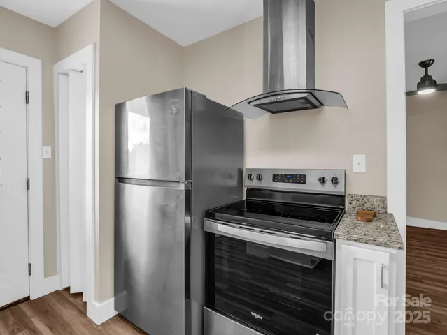 a kitchen with cabinets and stainless steel appliances