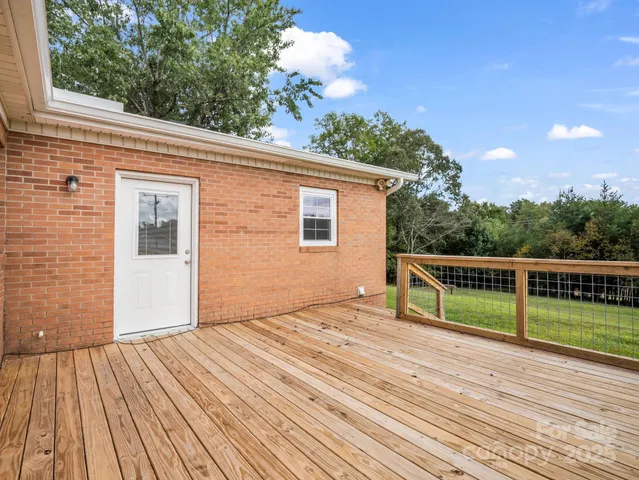 a view of outdoor space with deck and yard