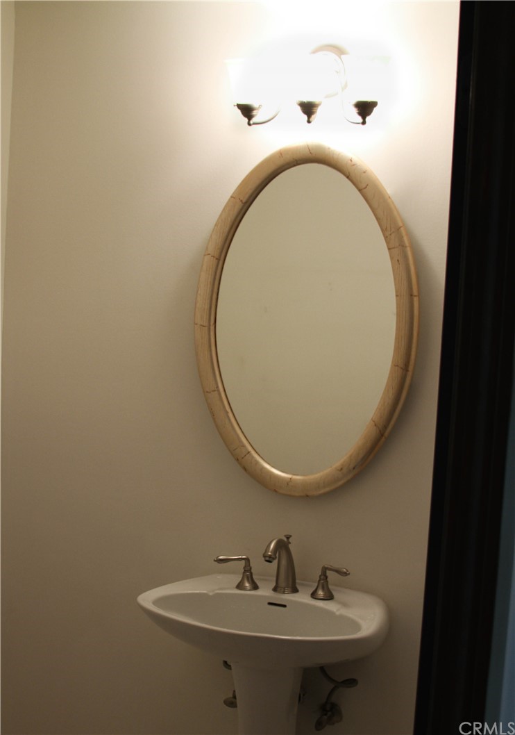 2 Cambridge Manhattan Beach, CA 90266 - Photo 13 of 33 a bathroom with a sink and a mirror