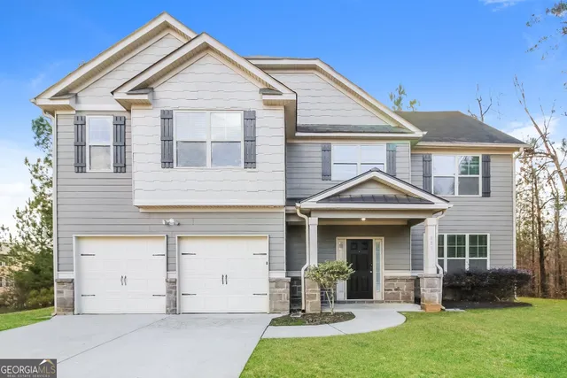 front view of a house with a yard