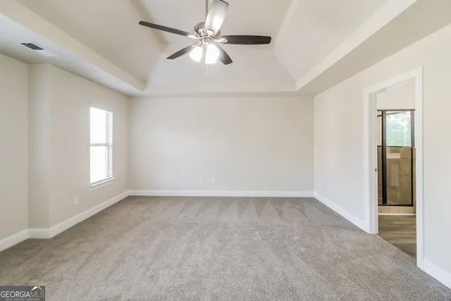 a view of an empty room with a window