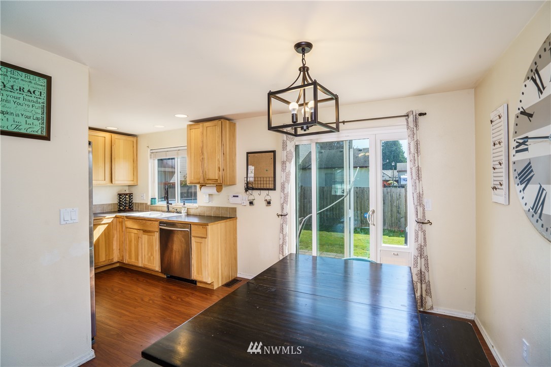 417 Spring Lane Sedro-Woolley, WA 98284 - Photo 8 of 29 a view of a big room with wooden floor windows and a livingroom