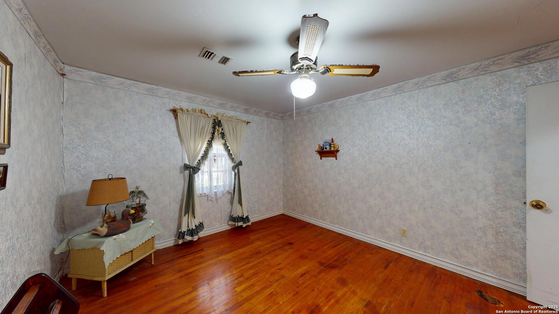 607 Exchange Schertz, TX 78154 - Photo 17 of 34 a bedroom with a bed and chandelier