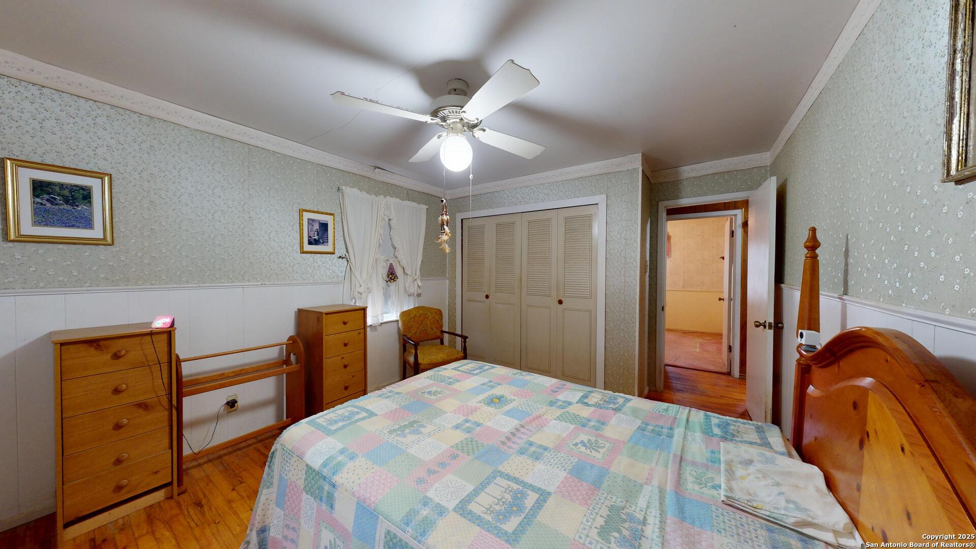 607 Exchange Schertz, TX 78154 - Photo 21 of 34 a bedroom with a bed and a dresser