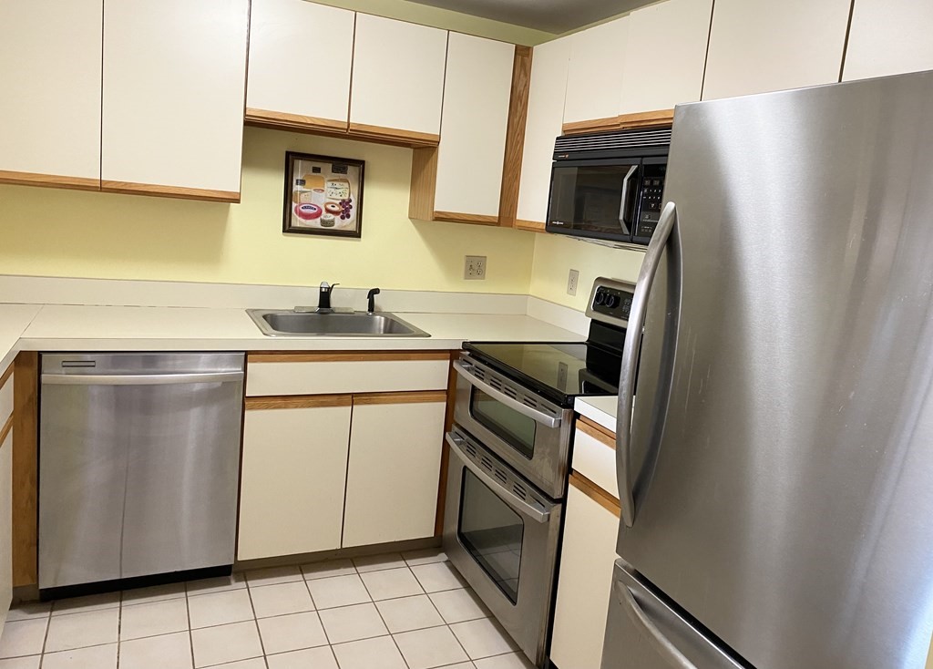 a utility room with sink dryer and washer