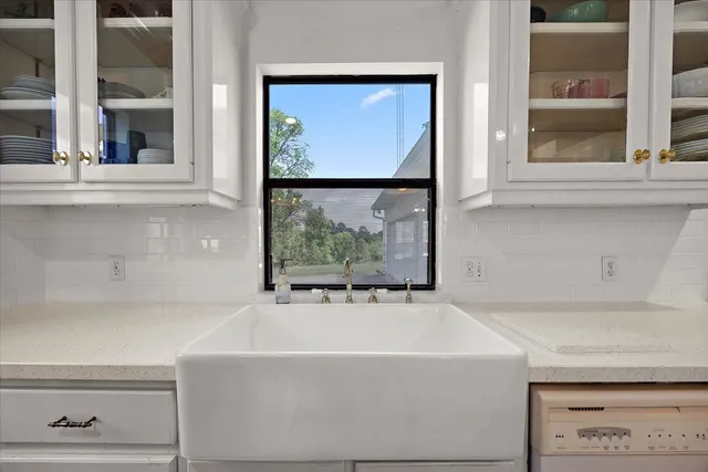 a white bath tub sitting next to a window