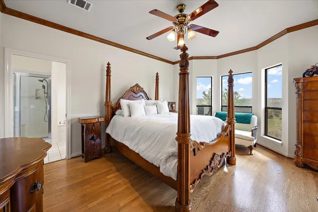 a bed room with a bed and a chandelier